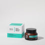 Frosted amber glass bottle and cardboard display box of 001-Pu Purifying Facial against light grey background