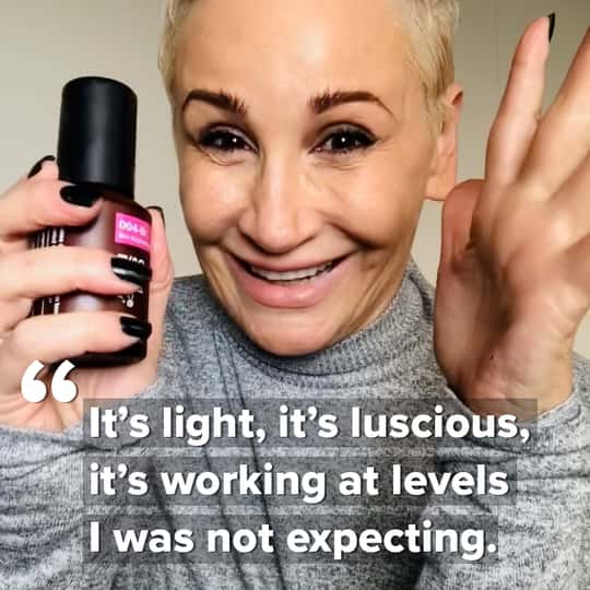 Laughing customer Jill R. with bottle of 004-Br-Skin Brightening Cream in her hand. Caption quotes her: