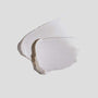 Texture shot of 001-Pu Purifying Facial on white surface