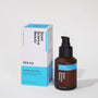 Frosted amber glass bottle and cardboard product box of 005-Fi Skin Firming Cream against light grey background