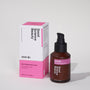Frosted amber glass bottle and cardboard product box of 004-Br Skin Brightening Cream against light grey background
